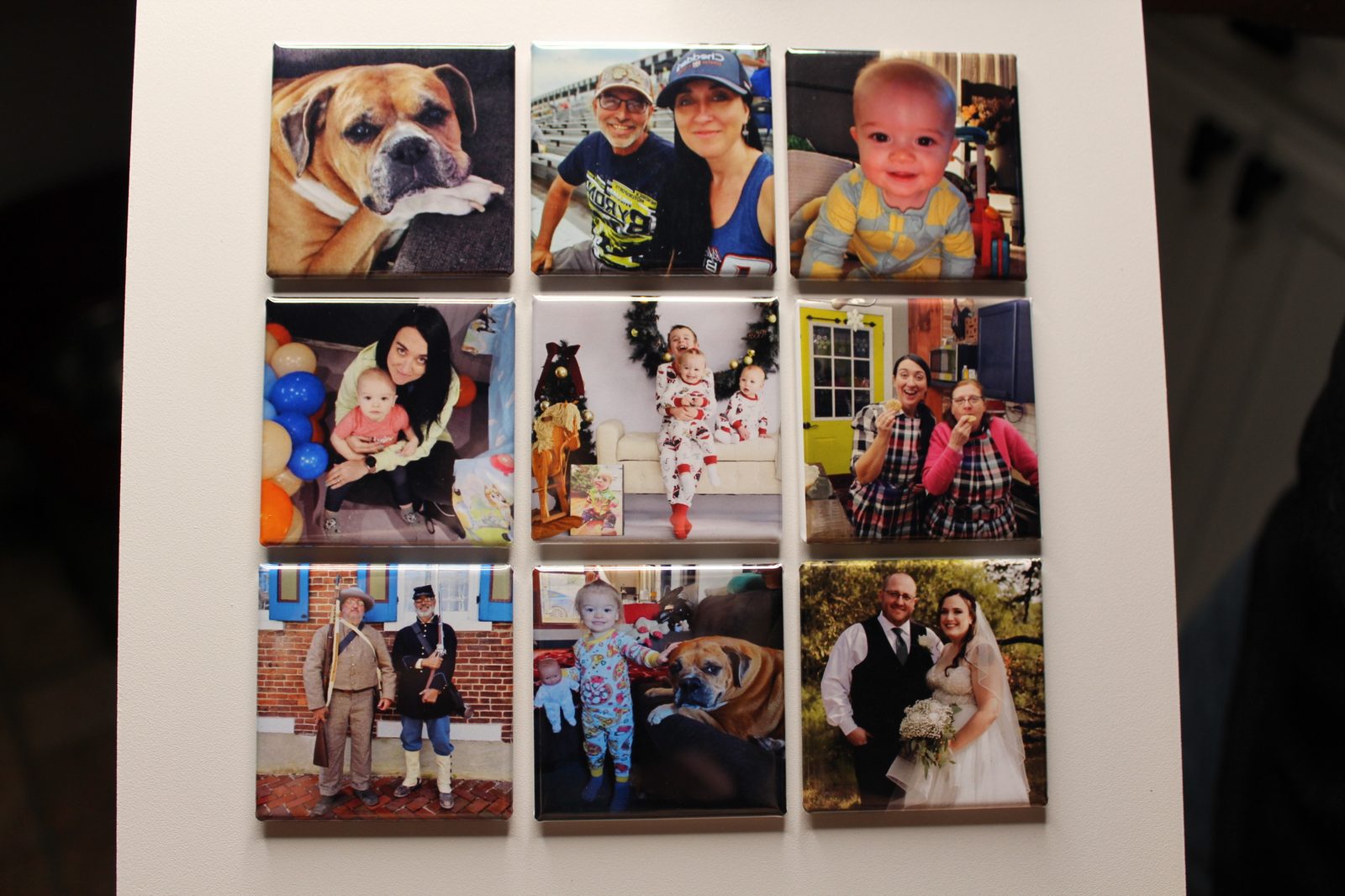 A magnet board of nine custom photo magnets — family, travel and pet memories