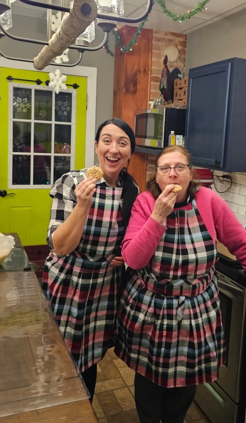 Marie and her mom Maggie sharing cookies in the kitchen